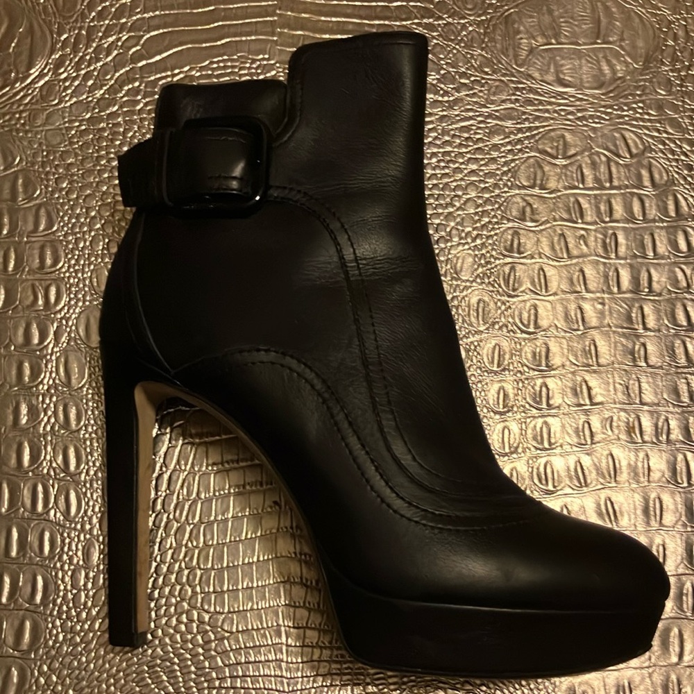 Black Jimmy Choo boots.